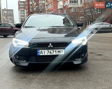 Черный Мицубиси Лансер, объемом двигателя 2 л и пробегом 217 тыс. км за 7000 $, фото 11 на Automoto.ua