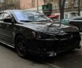 Черный Мицубиси Лансер, объемом двигателя 2 л и пробегом 200 тыс. км за 7500 $, фото 5 на Automoto.ua
