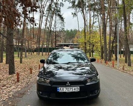 Черный Мицубиси Лансер, объемом двигателя 2 л и пробегом 216 тыс. км за 5600 $, фото 1 на Automoto.ua