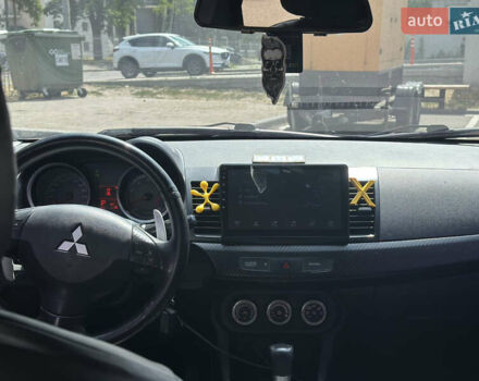 Черный Мицубиси Лансер, объемом двигателя 2 л и пробегом 295 тыс. км за 7000 $, фото 7 на Automoto.ua