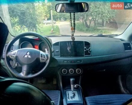 Черный Мицубиси Лансер, объемом двигателя 2 л и пробегом 180 тыс. км за 5800 $, фото 3 на Automoto.ua