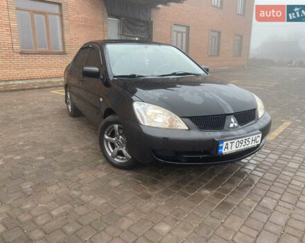 Черный Мицубиси Лансер, объемом двигателя 1.58 л и пробегом 211 тыс. км за 6333 $, фото 25 на Automoto.ua