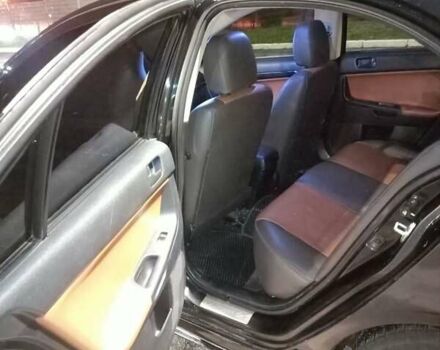 Черный Мицубиси Лансер, объемом двигателя 2 л и пробегом 240 тыс. км за 6400 $, фото 9 на Automoto.ua