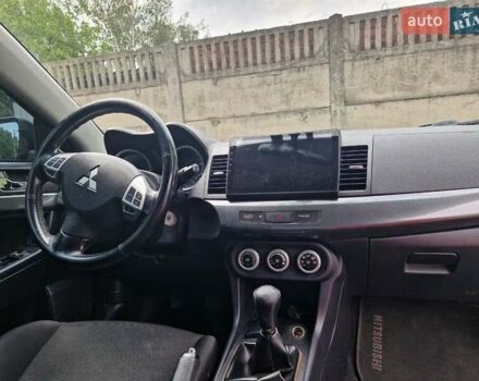 Черный Мицубиси Лансер, объемом двигателя 2 л и пробегом 178 тыс. км за 7000 $, фото 4 на Automoto.ua
