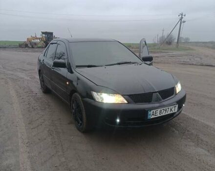 Чорний Міцубісі Lancer, об'ємом двигуна 1.58 л та пробігом 233 тис. км за 4800 $, фото 14 на Automoto.ua
