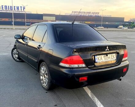Чорний Міцубісі Lancer, об'ємом двигуна 1.6 л та пробігом 375 тис. км за 4899 $, фото 2 на Automoto.ua