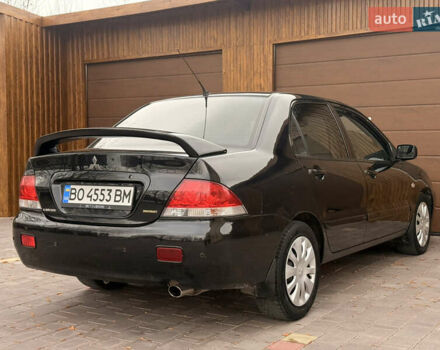 Чорний Міцубісі Lancer, об'ємом двигуна 1.6 л та пробігом 265 тис. км за 4700 $, фото 11 на Automoto.ua