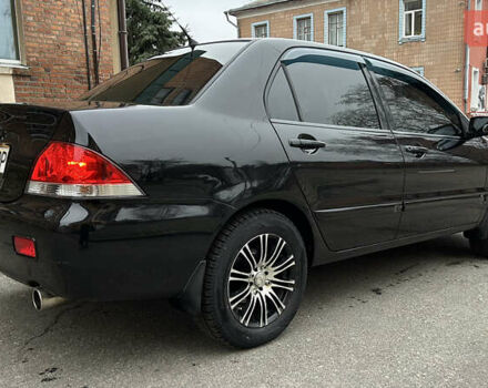 Чорний Міцубісі Lancer, об'ємом двигуна 1.58 л та пробігом 167 тис. км за 4800 $, фото 4 на Automoto.ua