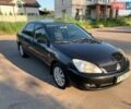 Черный Мицубиси Лансер, объемом двигателя 1.6 л и пробегом 299 тыс. км за 4150 $, фото 1 на Automoto.ua
