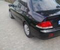 Чорний Міцубісі Lancer, об'ємом двигуна 1.6 л та пробігом 200 тис. км за 3500 $, фото 4 на Automoto.ua