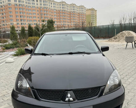 Черный Мицубиси Лансер, объемом двигателя 1.6 л и пробегом 240 тыс. км за 5200 $, фото 1 на Automoto.ua