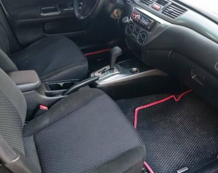Чорний Міцубісі Lancer, об'ємом двигуна 1.58 л та пробігом 286 тис. км за 4950 $, фото 17 на Automoto.ua
