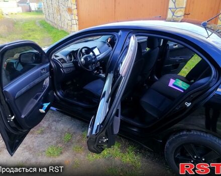 Черный Мицубиси Лансер, объемом двигателя 2 л и пробегом 196 тыс. км за 5500 $, фото 4 на Automoto.ua