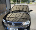 Чорний Міцубісі Lancer, об'ємом двигуна 1.58 л та пробігом 260 тис. км за 4800 $, фото 1 на Automoto.ua
