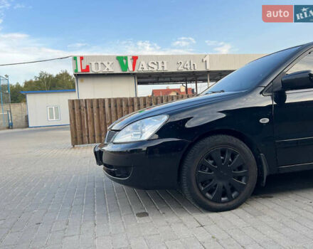 Чорний Міцубісі Lancer, об'ємом двигуна 1.58 л та пробігом 237 тис. км за 4500 $, фото 2 на Automoto.ua