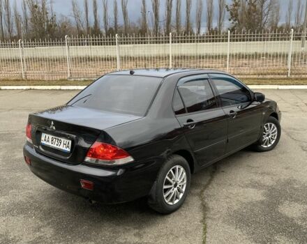 Черный Мицубиси Лансер, объемом двигателя 1.6 л и пробегом 350 тыс. км за 4500 $, фото 3 на Automoto.ua