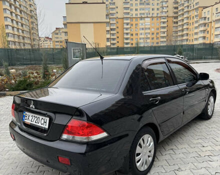 Черный Мицубиси Лансер, объемом двигателя 1.6 л и пробегом 240 тыс. км за 5200 $, фото 8 на Automoto.ua