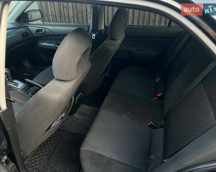 Чорний Міцубісі Lancer, об'ємом двигуна 1.58 л та пробігом 237 тис. км за 4500 $, фото 14 на Automoto.ua