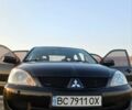 Чорний Міцубісі Lancer, об'ємом двигуна 1.58 л та пробігом 291 тис. км за 5400 $, фото 2 на Automoto.ua