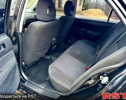 Черный Мицубиси Лансер, объемом двигателя 1.6 л и пробегом 216 тыс. км за 5190 $, фото 9 на Automoto.ua