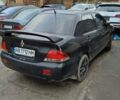Черный Мицубиси Лансер, объемом двигателя 1.6 л и пробегом 200 тыс. км за 2000 $, фото 2 на Automoto.ua