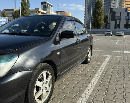 Черный Мицубиси Лансер, объемом двигателя 1.58 л и пробегом 364 тыс. км за 3000 $, фото 3 на Automoto.ua