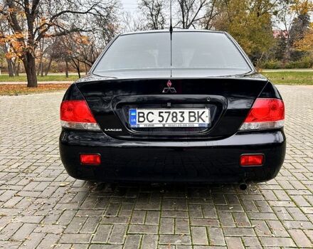 Черный Мицубиси Лансер, объемом двигателя 1.6 л и пробегом 185 тыс. км за 5500 $, фото 3 на Automoto.ua