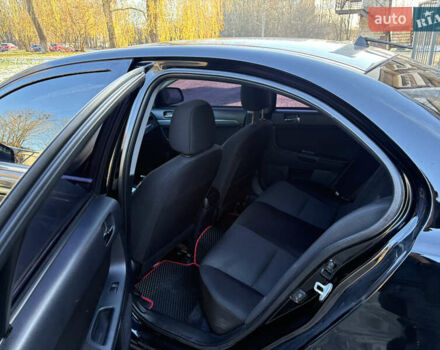 Черный Мицубиси Лансер, объемом двигателя 2 л и пробегом 236 тыс. км за 6450 $, фото 7 на Automoto.ua