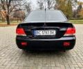Черный Мицубиси Лансер, объемом двигателя 1.6 л и пробегом 185 тыс. км за 5500 $, фото 3 на Automoto.ua