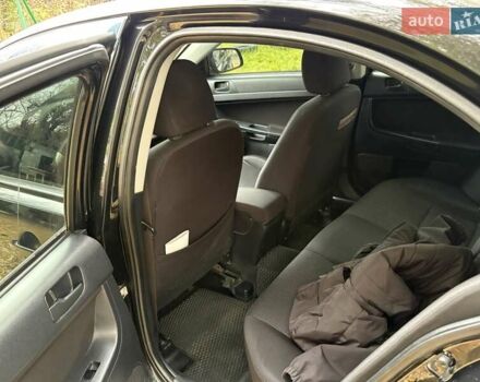 Черный Мицубиси Лансер, объемом двигателя 2 л и пробегом 260 тыс. км за 6100 $, фото 15 на Automoto.ua