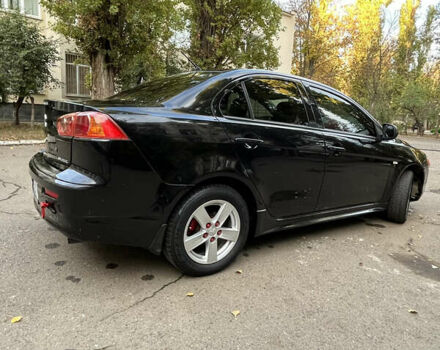 Чорний Міцубісі Lancer, об'ємом двигуна 2 л та пробігом 206 тис. км за 5600 $, фото 37 на Automoto.ua