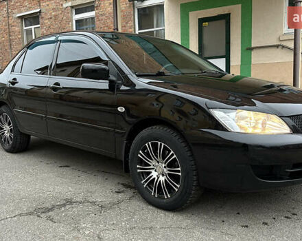 Чорний Міцубісі Lancer, об'ємом двигуна 1.58 л та пробігом 167 тис. км за 4800 $, фото 6 на Automoto.ua
