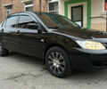 Чорний Міцубісі Lancer, об'ємом двигуна 1.58 л та пробігом 167 тис. км за 4800 $, фото 6 на Automoto.ua