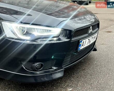 Черный Мицубиси Лансер, объемом двигателя 2 л и пробегом 217 тыс. км за 7000 $, фото 12 на Automoto.ua