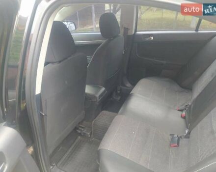 Чорний Міцубісі Lancer, об'ємом двигуна 2 л та пробігом 183 тис. км за 5000 $, фото 7 на Automoto.ua