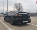 Чорний Міцубісі Lancer, об'ємом двигуна 2 л та пробігом 160 тис. км за 8000 $, фото 1 на Automoto.ua