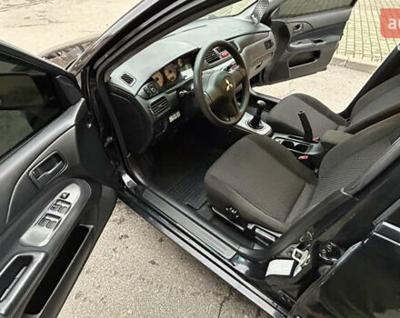 Чорний Міцубісі Lancer, об'ємом двигуна 1.58 л та пробігом 167 тис. км за 4800 $, фото 9 на Automoto.ua