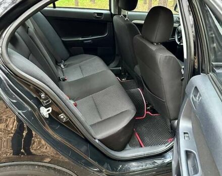 Черный Мицубиси Лансер, объемом двигателя 2 л и пробегом 216 тыс. км за 5600 $, фото 9 на Automoto.ua