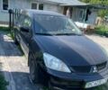 Чорний Міцубісі Lancer, об'ємом двигуна 1.6 л та пробігом 310 тис. км за 4000 $, фото 1 на Automoto.ua