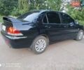 Черный Мицубиси Лансер, объемом двигателя 1.58 л и пробегом 217 тыс. км за 4900 $, фото 9 на Automoto.ua