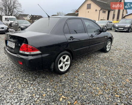 Черный Мицубиси Лансер, объемом двигателя 1.58 л и пробегом 202 тыс. км за 4100 $, фото 19 на Automoto.ua