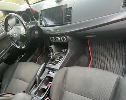 Черный Мицубиси Лансер, объемом двигателя 2 л и пробегом 270 тыс. км за 5600 $, фото 9 на Automoto.ua