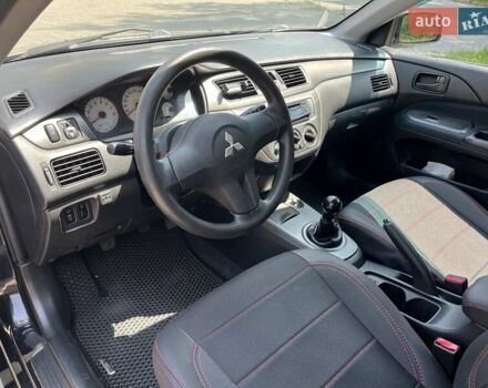 Чорний Міцубісі Lancer, об'ємом двигуна 1.6 л та пробігом 296 тис. км за 4200 $, фото 33 на Automoto.ua