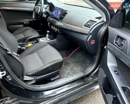 Черный Мицубиси Лансер, объемом двигателя 2 л и пробегом 217 тыс. км за 7000 $, фото 4 на Automoto.ua