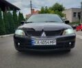 Чорний Міцубісі Lancer, об'ємом двигуна 1.58 л та пробігом 334 тис. км за 4750 $, фото 1 на Automoto.ua