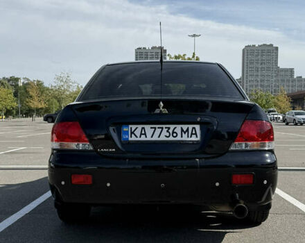 Черный Мицубиси Лансер, объемом двигателя 1.6 л и пробегом 321 тыс. км за 5000 $, фото 2 на Automoto.ua