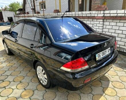 Чорний Міцубісі Lancer, об'ємом двигуна 0.16 л та пробігом 153 тис. км за 4200 $, фото 6 на Automoto.ua