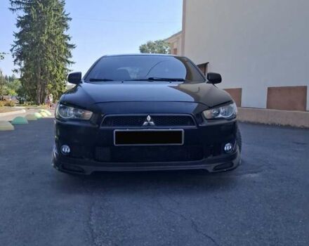 Черный Мицубиси Лансер, объемом двигателя 2 л и пробегом 230 тыс. км за 7000 $, фото 24 на Automoto.ua