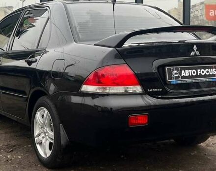 Чорний Міцубісі Lancer, об'ємом двигуна 1.6 л та пробігом 340 тис. км за 6190 $, фото 5 на Automoto.ua