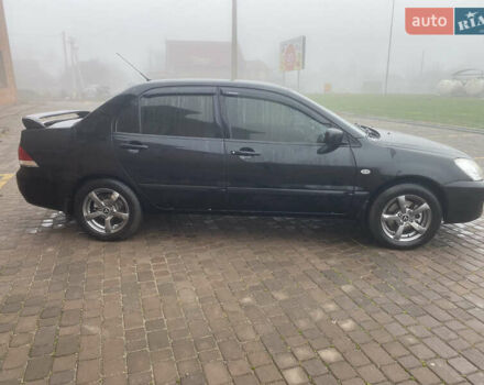 Черный Мицубиси Лансер, объемом двигателя 1.58 л и пробегом 211 тыс. км за 6333 $, фото 13 на Automoto.ua